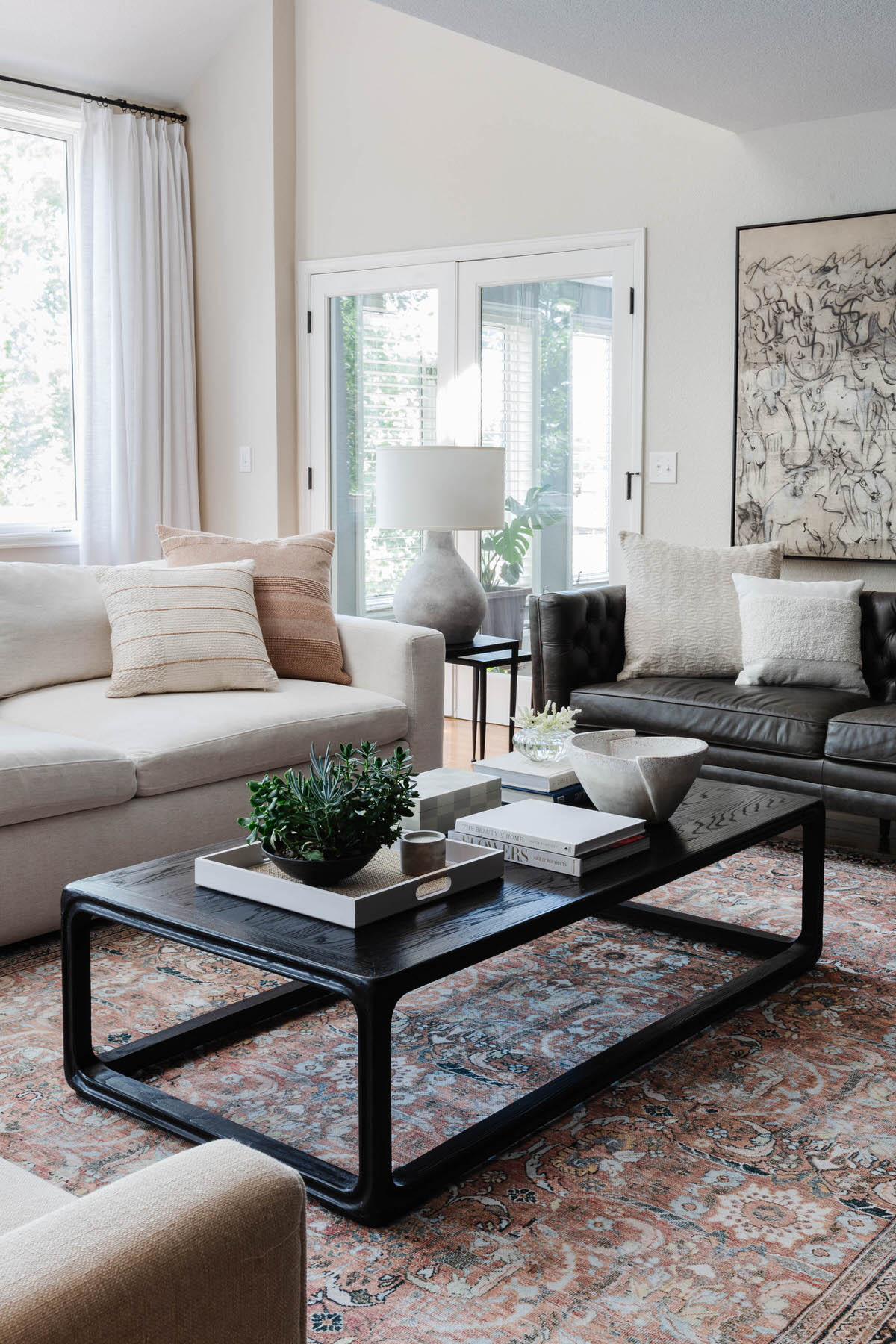 Contemporary Living Room with Vintage Inspired Rug and Warm Modern Colors by Denver Interior Designer Peggy Haddad