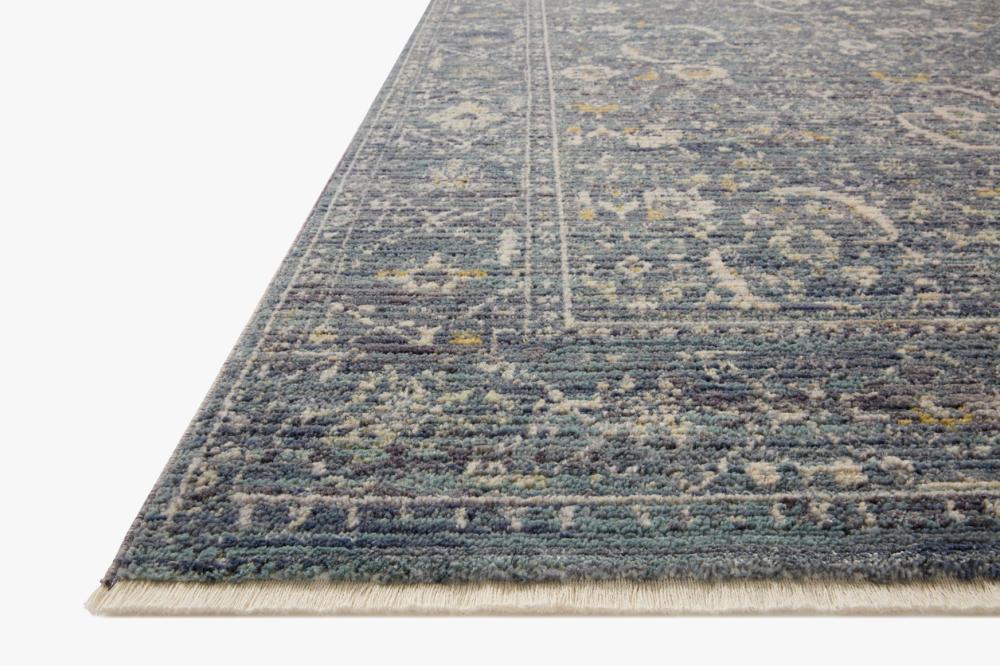 Versatile deep blue rug, adapts to tradition or contemporary, statement piece uniting eclectic elements, adds refinement and coherence to any room.