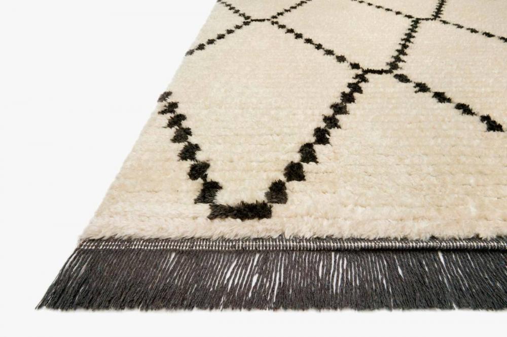 Creamy charcoal boho rug. Textured surface, diamond motifs, and lively fringe, transforming rooms into sanctuaries, Perfect for boho spaces