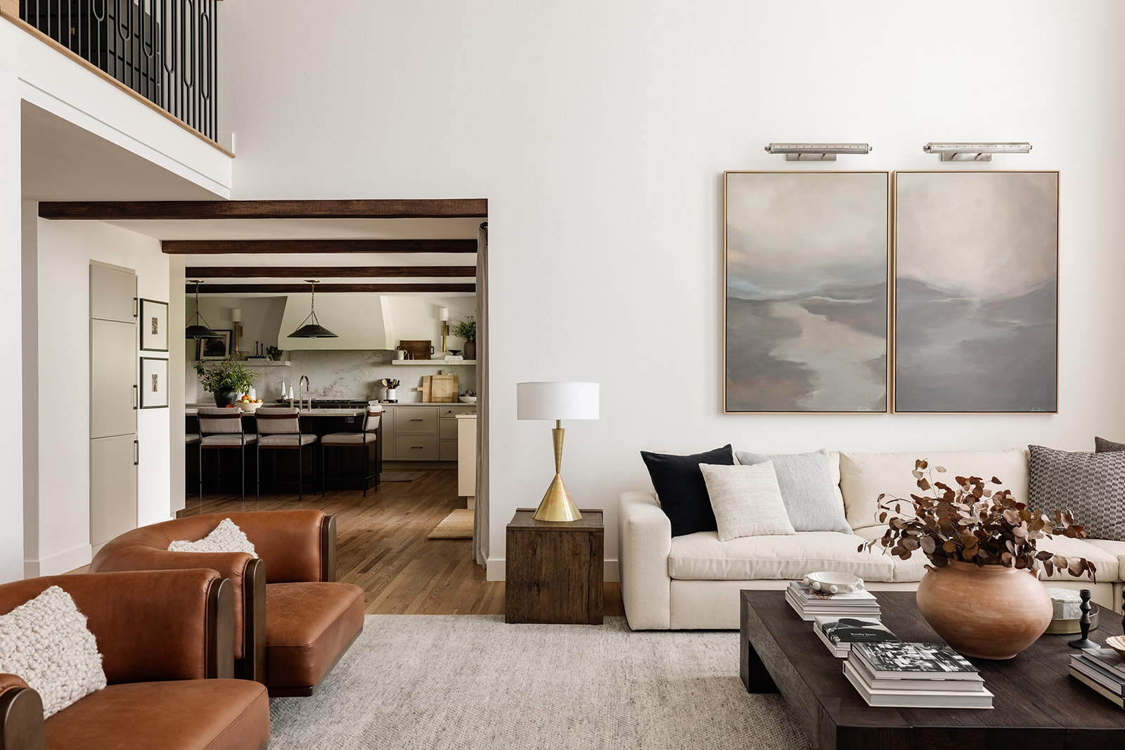 In this large living room layout, we anchored the room with a large high-performance sectional, providing ample seating for lounging and gatherings. We then incorporated four accent chairs, allowing for additional seating without closing off the space.